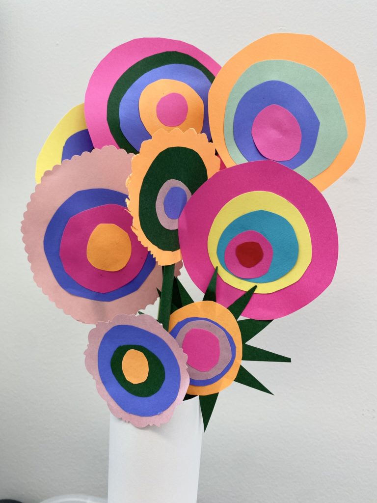 A bouquet of multicoloured circular flowers made of construction paper